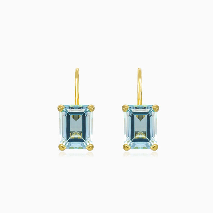 Boucles d’oreilles en or avec topaze bleue
