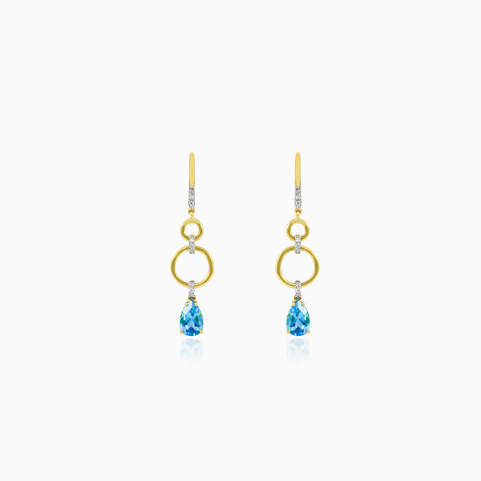 Dangling pear topaz earrings