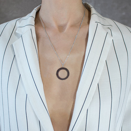 Open circle garnet pendant