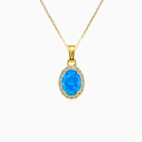 Oval halo blue opal pendant