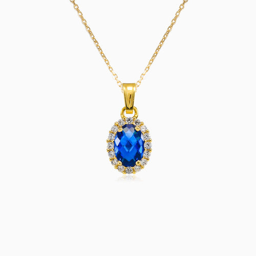 Oval blue quartz gold pendant