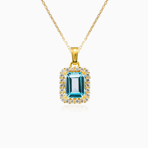 Halo emerald-cut blue topaz gold pendant