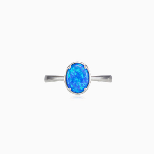 Tiny prong oval blue opal ring