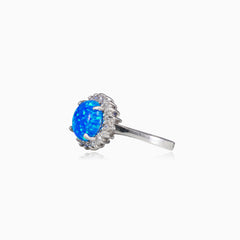 Prsten s modrým kulatým opálem a lunetou