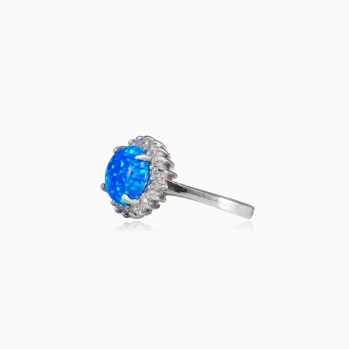 Prsten s modrým kulatým opálem a lunetou