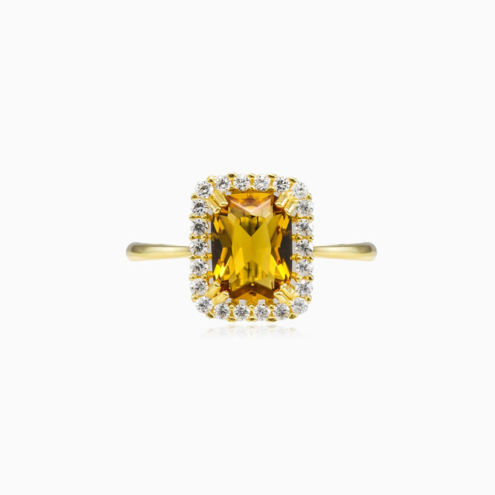 Bague avec citrine radiante et halo.