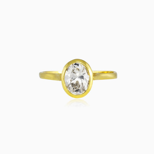 Bezel set oval crystal gold ring