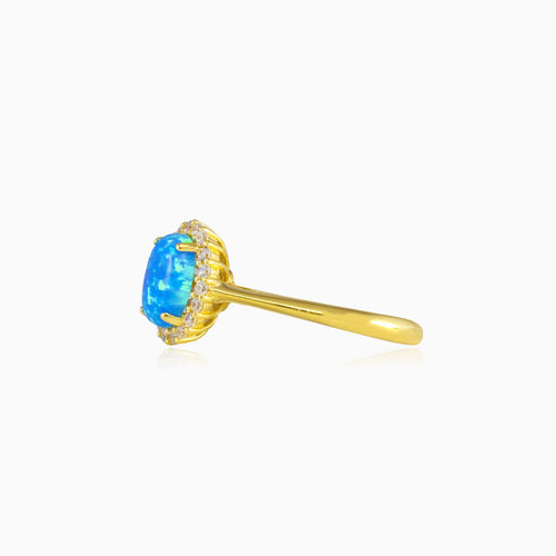 Zlatý prsten s oválným modrým opálem