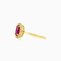 Oval rubellite halo gold ring